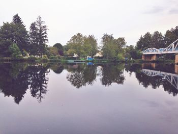 Reflection of trees in calm lake