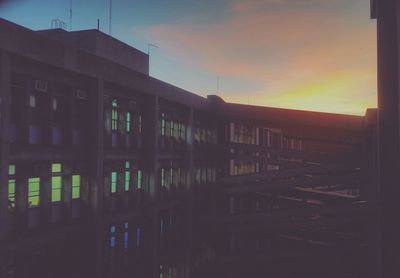 Built structure against sky at sunset