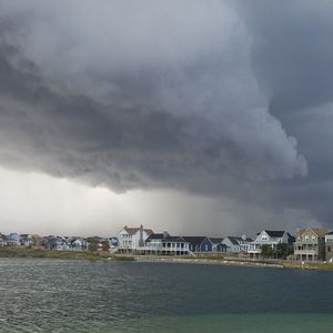 View of calm sea against cloudy sky