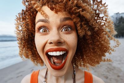 Portrait of young woman with curly hair