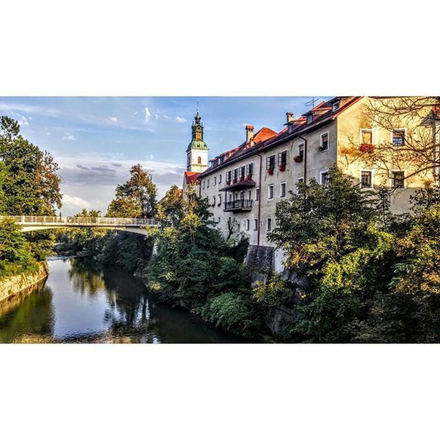 architecture, built structure, building exterior, water, tree, reflection, transfer print, sky, waterfront, river, auto post production filter, day, canal, residential structure, city, residential building, travel destinations, outdoors, building, clear sky