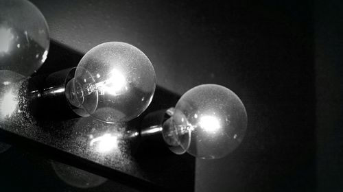 Low angle view of illuminated light bulb