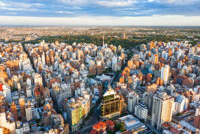 High angle view of modern buildings in city against sky