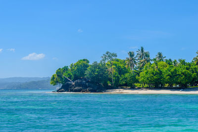 Scenic view of sea against blue sky