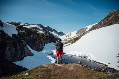 People standing on snow covered landscape