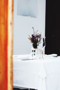 Flower vase on table at home