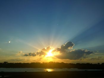 Scenic view of sunset over river