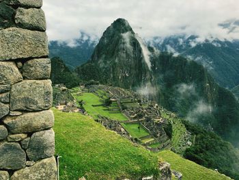 Scenic view of mountain against cloudy sky