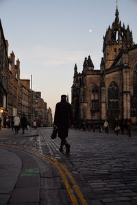 People walking on street in city