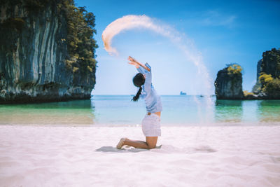 Full length of man on beach against sky