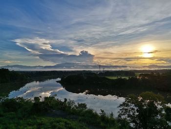Scenic view of lake against sky during sunset
