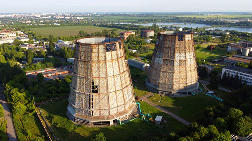 Aerial drone view flight near thermal power plant cooling towers of chp thermoelectric power station