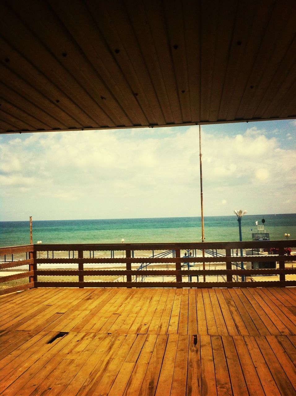 sea, horizon over water, water, sky, pier, railing, tranquility, tranquil scene, scenics, cloud - sky, beach, nature, cloud, beauty in nature, wood - material, idyllic, day, cloudy, blue, jetty