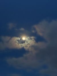 Low angle view of cloudy sky at night