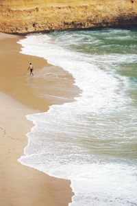 High angle view of man on shore at beach