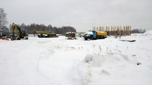 Scenic view of snow covered field