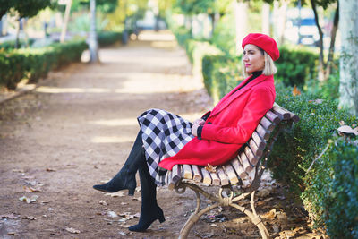 Portrait of woman sitting on bench