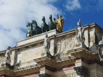 Low angle view of statue against sky