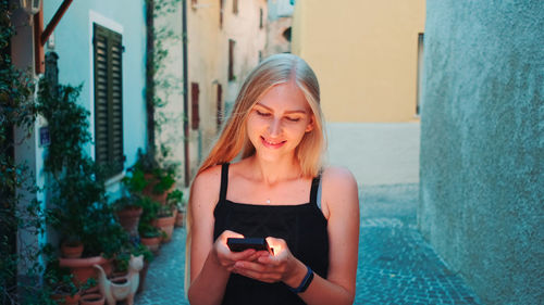 Young woman using mobile phone