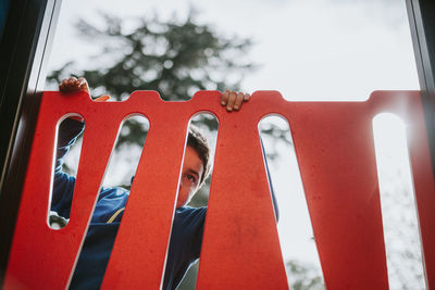 Boy at outdoor play equipment