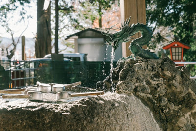 Close-up of fountain against building