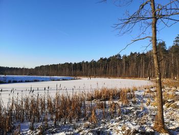 Scenic view of frozen lake against sky