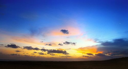 Scenic view of sea against sky at sunset