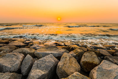 Scenic view of sea against sky during sunset