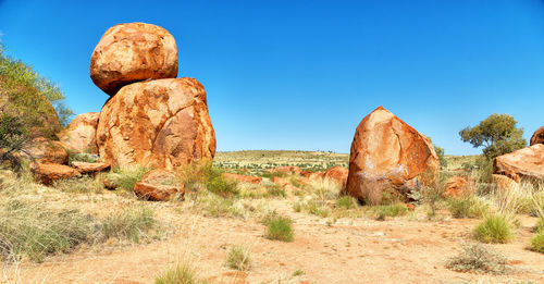 Rock formation against clear blue sky