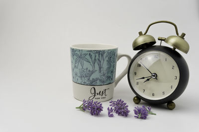 Close-up of clock against white background