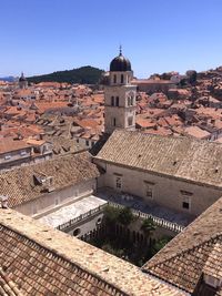 Aerial view of old church in city against clear sky