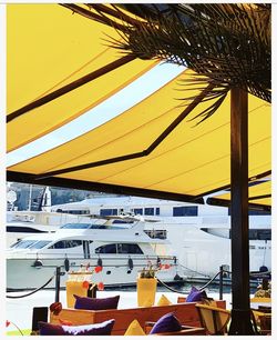 Low angle view of parasols against sky