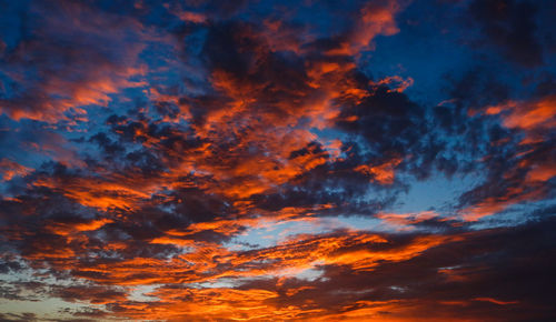 Low angle view of dramatic sky during sunset