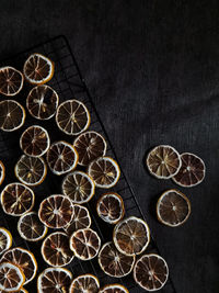 High angle view of lemon on table against black background