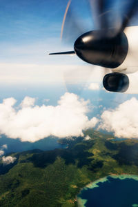 Low angle view of airplane flying in sky