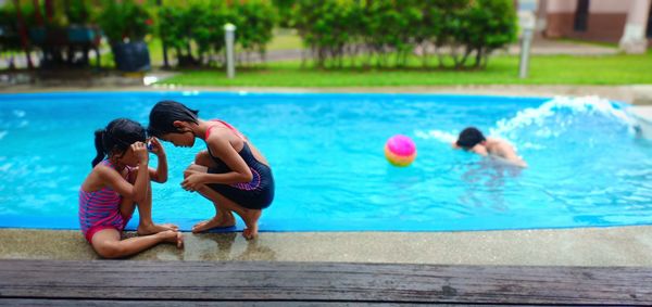 People enjoying in swimming pool