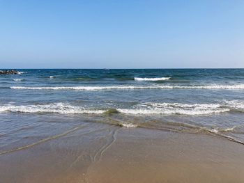 Scenic view of sea against clear sky