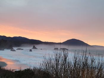 Scenic view of sea against sky during sunset