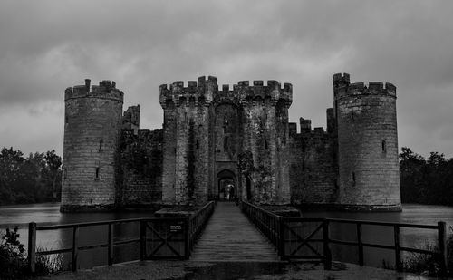 View of old building against cloudy sky
