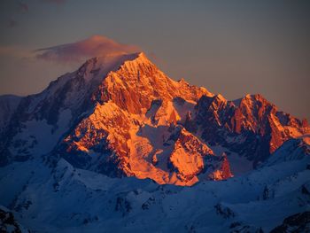 Scenic view of snow covered mountain against sky