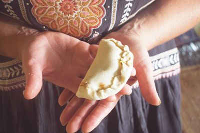 Close-up of hand holding ice cream