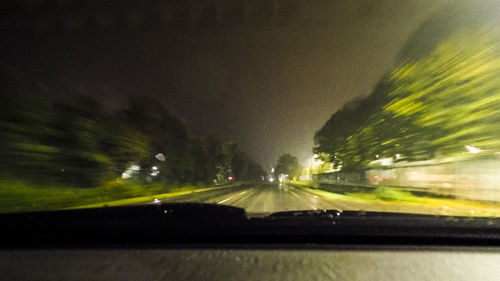 Cars on street seen through windshield