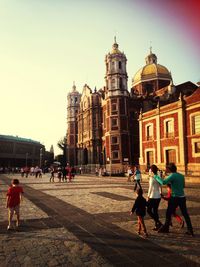 Tourists in front of building