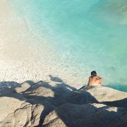 Woman sitting on beach