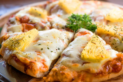 Close-up of pizza served on table