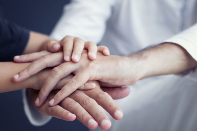 Midsection of couple holding hands