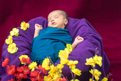 High angle view of mother and daughter on bed at home