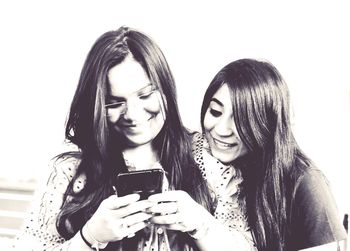 Portrait of young woman using smart phone