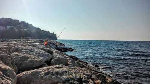 View of calm blue sea against clear sky