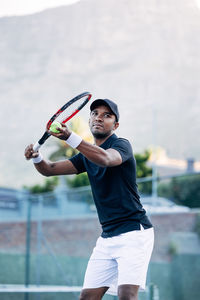 Young man playing tennis